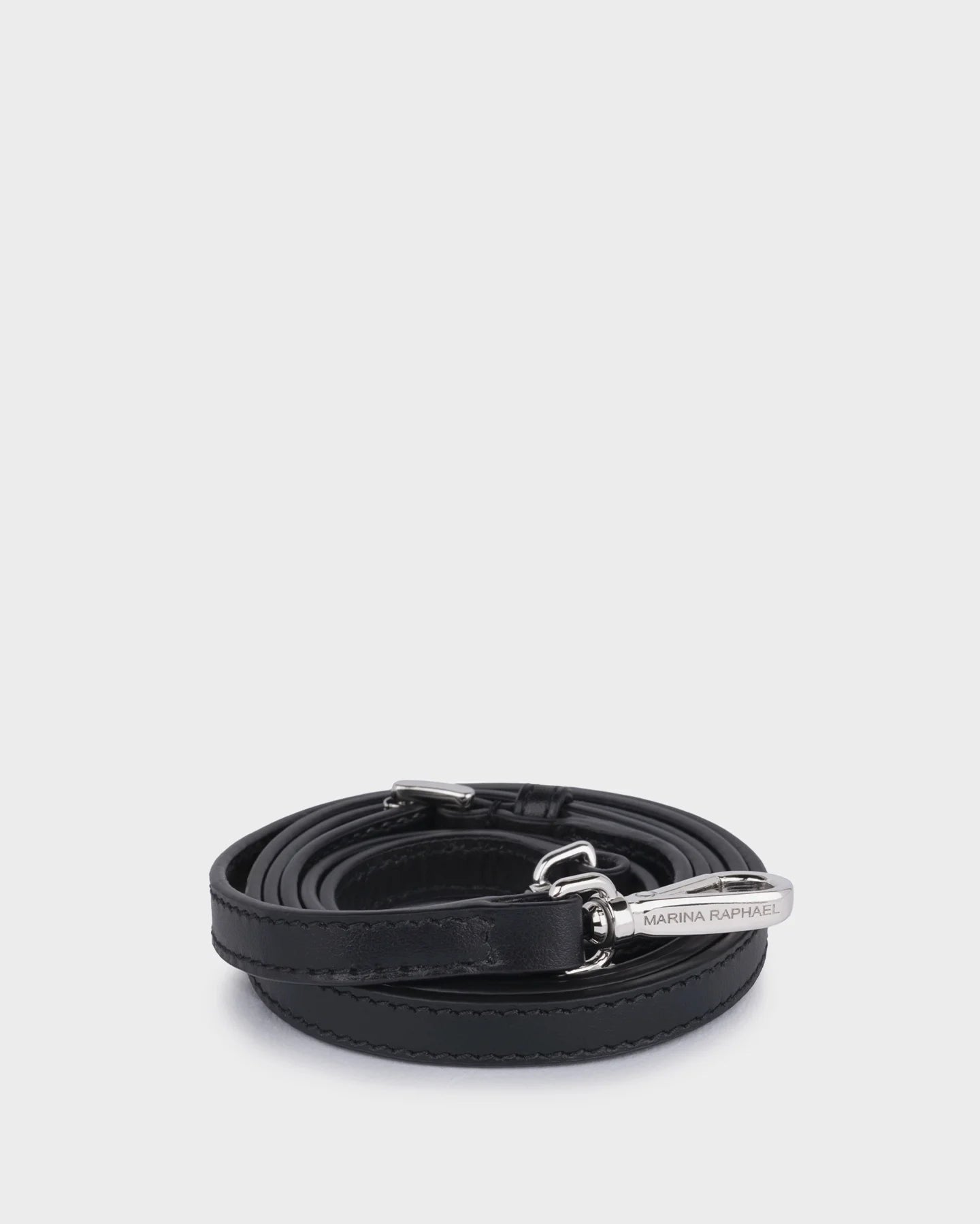 Thin, adjustable, black leather strap with silver hardware