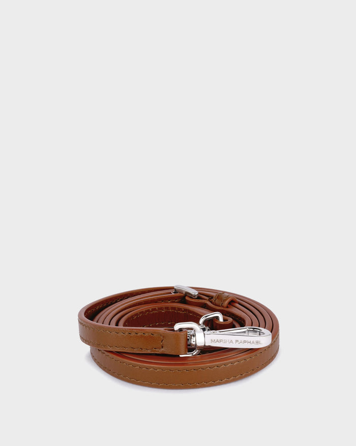Thin, adjustable, caramel leather strap with silver hardware