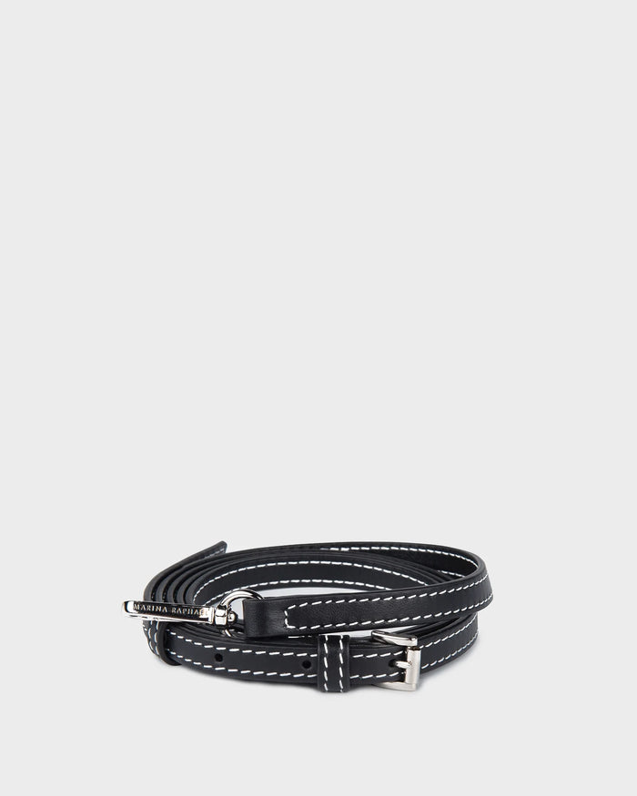 Thin, adjustable, black, napa leather strap with silver hardware and exposed stitching