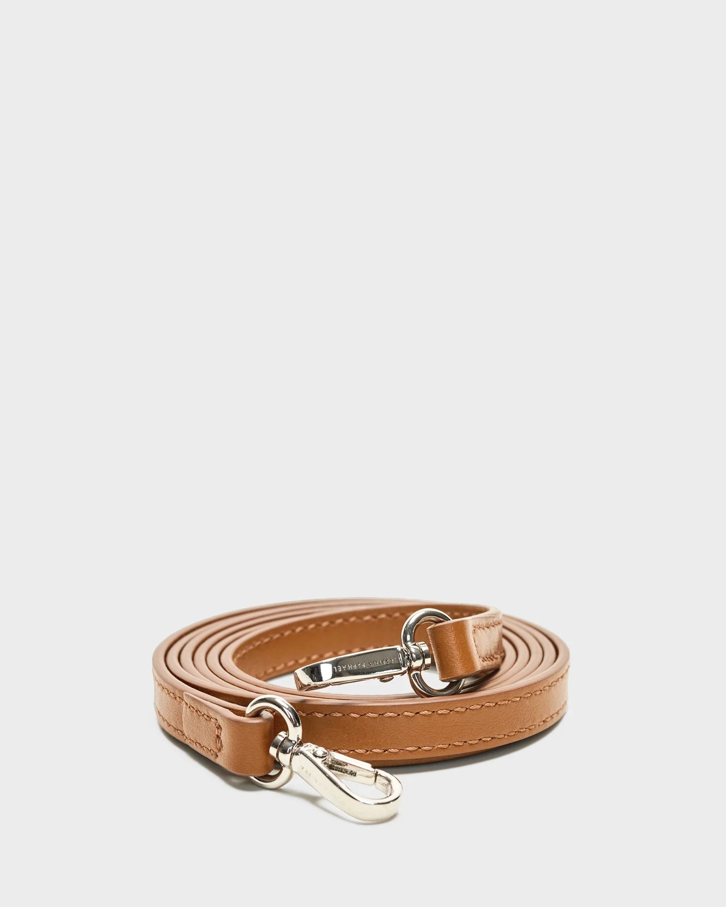 Thick, caramel, napa leather strap with silver hardware