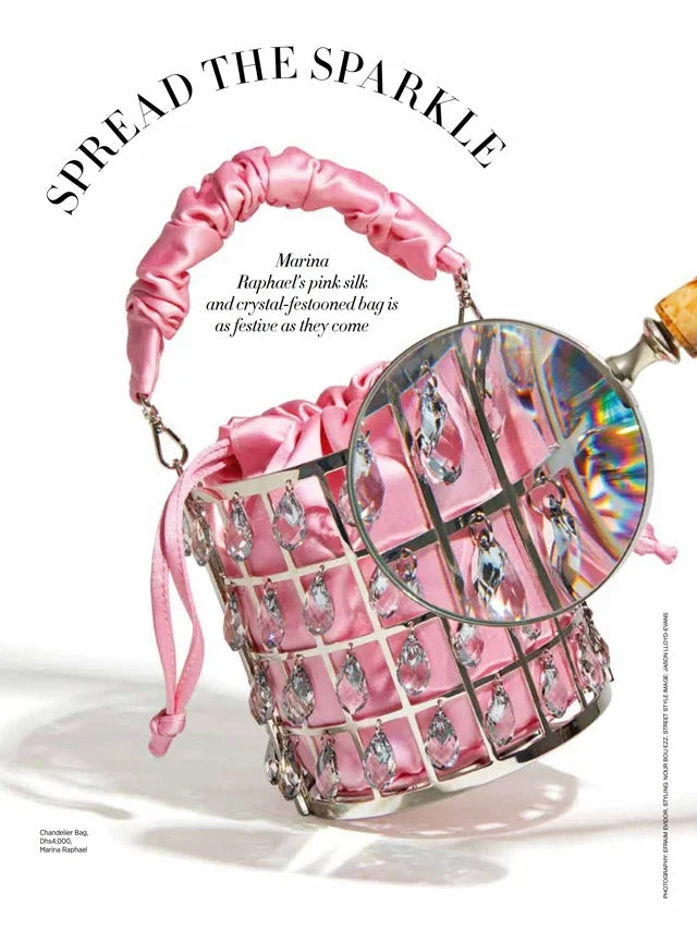 Page from the April 2022 issue of Harper's Bazaar Arabia magazine featuring: the Marina Raphael Chandelier in Pink Satin Handbag