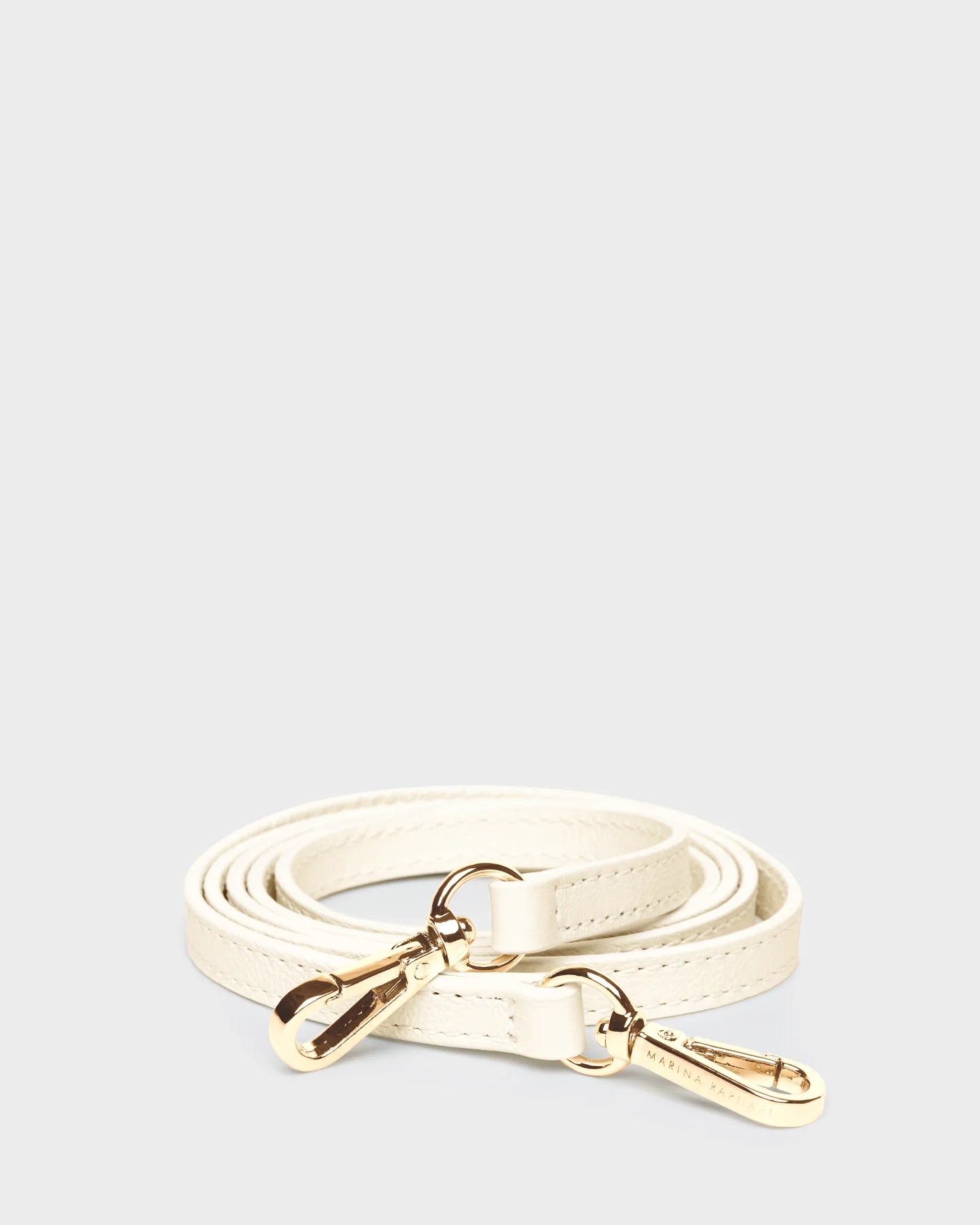 Thin, adjustable, cream, napa leather strap with gold hardware