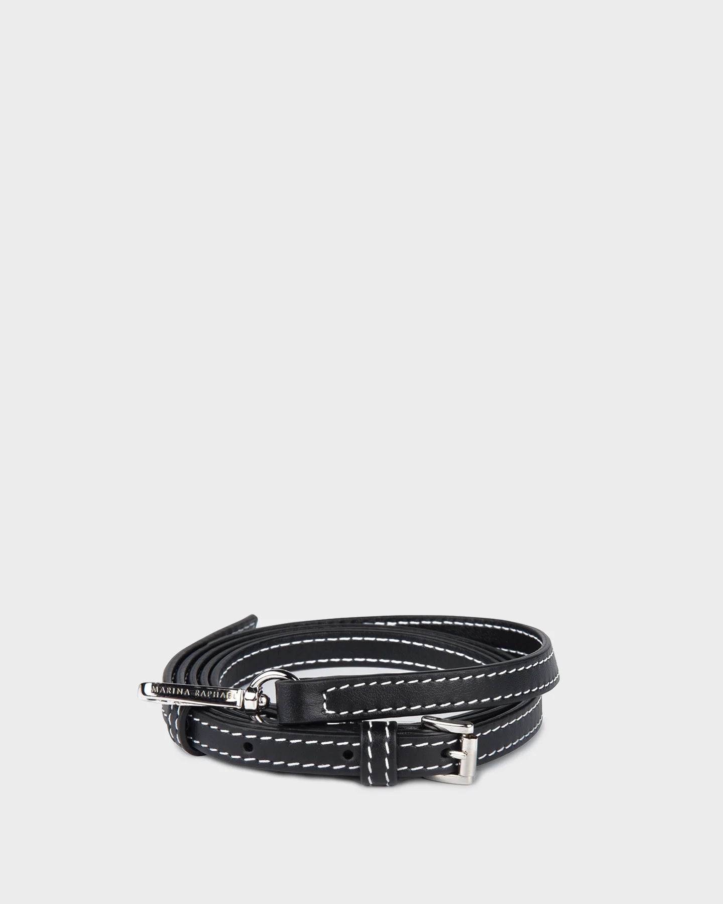 Thin, adjustable, black, napa leather strap with silver hardware and exposed stitching